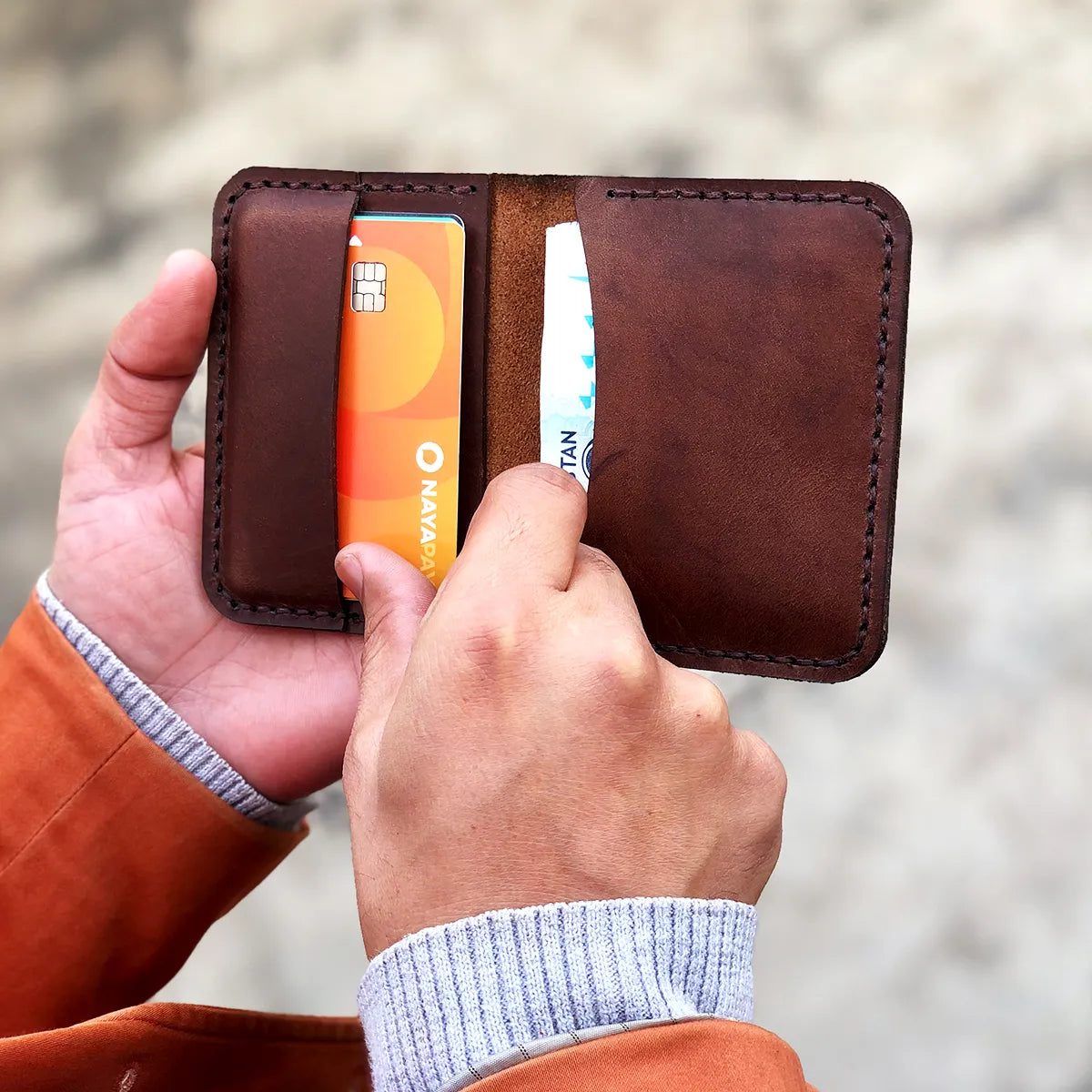 The Vertical Convenience: A Leather Bifold Wallet